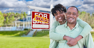 Happy African American Couple In Front of Beautiful House and So