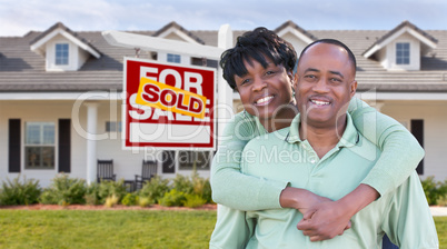 Happy African American Couple In Front of Beautiful House and So