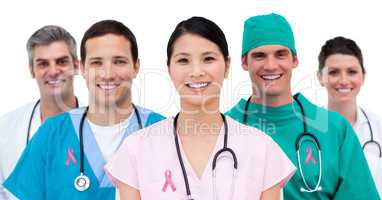 Doctors with breast cancer awareness ribbon