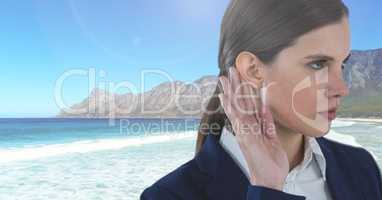 Businesswoman listening to sea