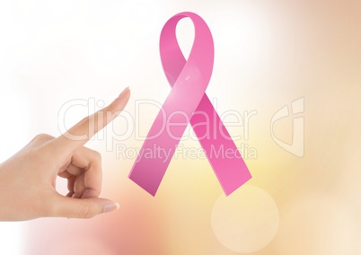 Pointing hand with pink ribbon for breast cancer awareness