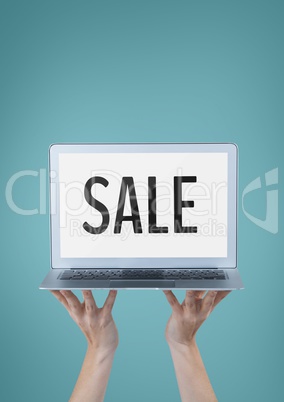 Business woman holding a computer with sale text