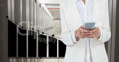 Business woman holding a phone and graphics in server room