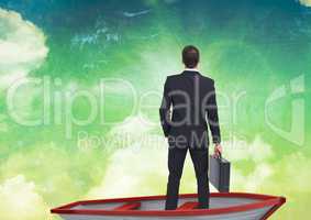 Businessman in boat under tropical sky clouds