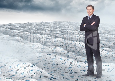 Businessman folding arms in sea of documents under sky clouds