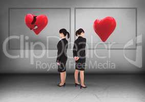 Broken heart or heart in frames with Businesswoman looking in opposite directions