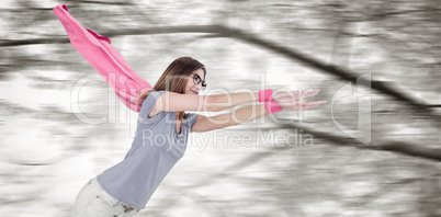 Composite image of woman in superhero costume pretending to fly