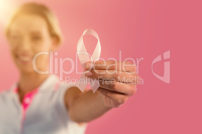 Woman holding breast cancer awareness ribbon