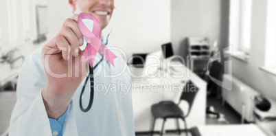 Composite image of doctor examining with stethoscope