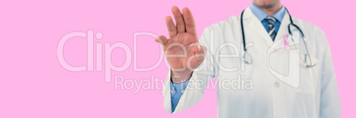 Composite image of doctor touching an digital screen