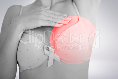 Composite image of mid section of woman in bra for breast cancer awareness