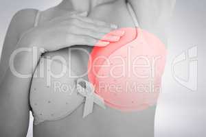 Composite image of mid section of woman in bra for breast cancer awareness