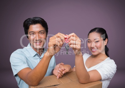 Couple Holding key in front of vignette