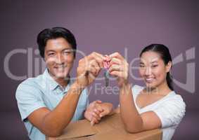 Couple Holding key in front of vignette