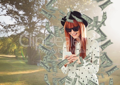 texting money. hipster with hat and phone in the park,  money around.