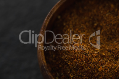 Close up of grounded food in wooden bowl