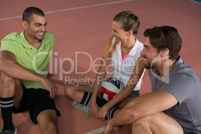 Happy volleyball players talking