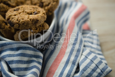 High angle view of cookies in bowl on napkin