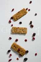 Granola bar with berries on white background