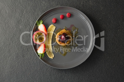 Healthy breakfast with fruits in a plate