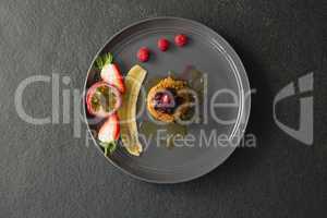 Healthy breakfast with fruits in a plate
