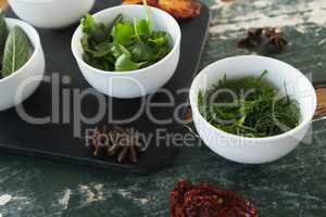 Spices and herbs on wooden table