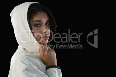 Female athlete in hooded jacket