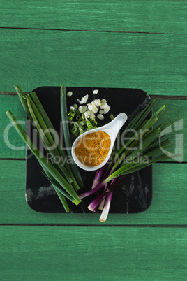 Scallions and turmeric on board