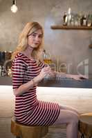 Portrait of beautiful woman having wine