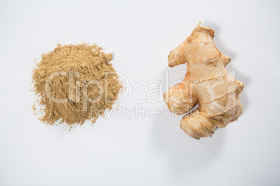 Overhead view of fresh ginger and powder