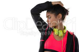 Athlete with headphones against white background