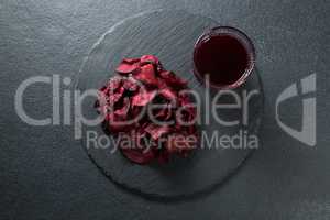 Overhead view of beetroot with juice on plate