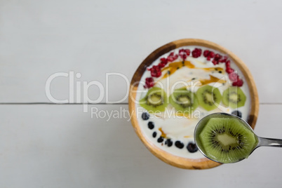 Sliced kiwi on spoon Sliced kiwi on spoon