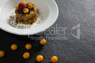 Granola bars with raspberry and golden berry in plate