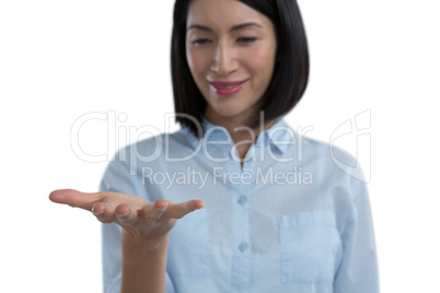 Woman pretending to hold an invisible object Woman pretending to hold an invisible object