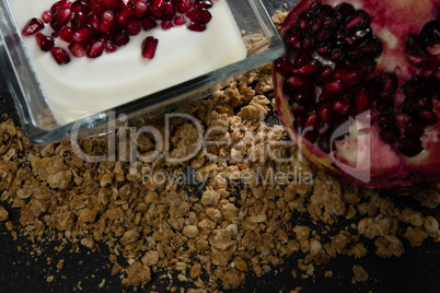 Yogurt with pomegranate slice and granola