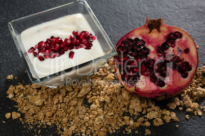 Yogurt with pomegranate slice and granola