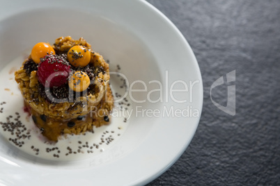 Granola bars with raspberry and golden berry in plate