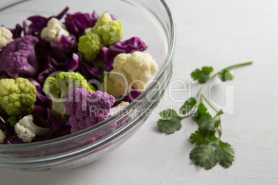 Close-up of cauliflowers with red cabbages in bowl