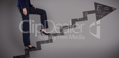 Composite image of conceptual image of businesswoman in heels climbing steps