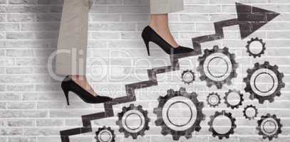 Composite image of low section of businesswoman climbing steps