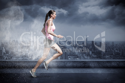 Composite image of profile view of sportswoman running on a white background