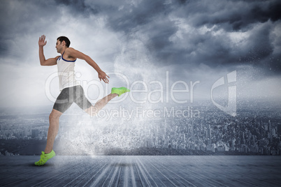 Composite image of male athlete running on white background