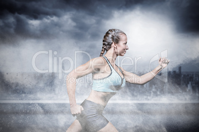 Composite image of side view of female athlete running