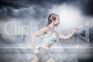 Composite image of side view of female athlete running