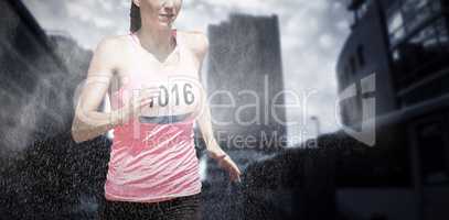Composite image of athletic woman running against white background