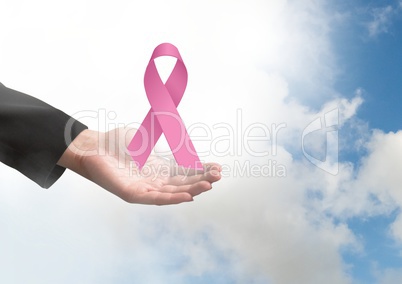 Open hand with pink ribbon for breast cancer awareness