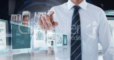 Businessman touching and interacting with technology interface panels