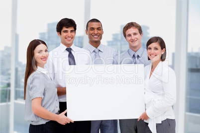 Business people holding blank card in office