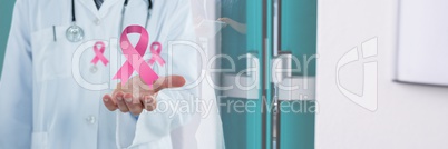 Doctor man with breast cancer awareness ribbon